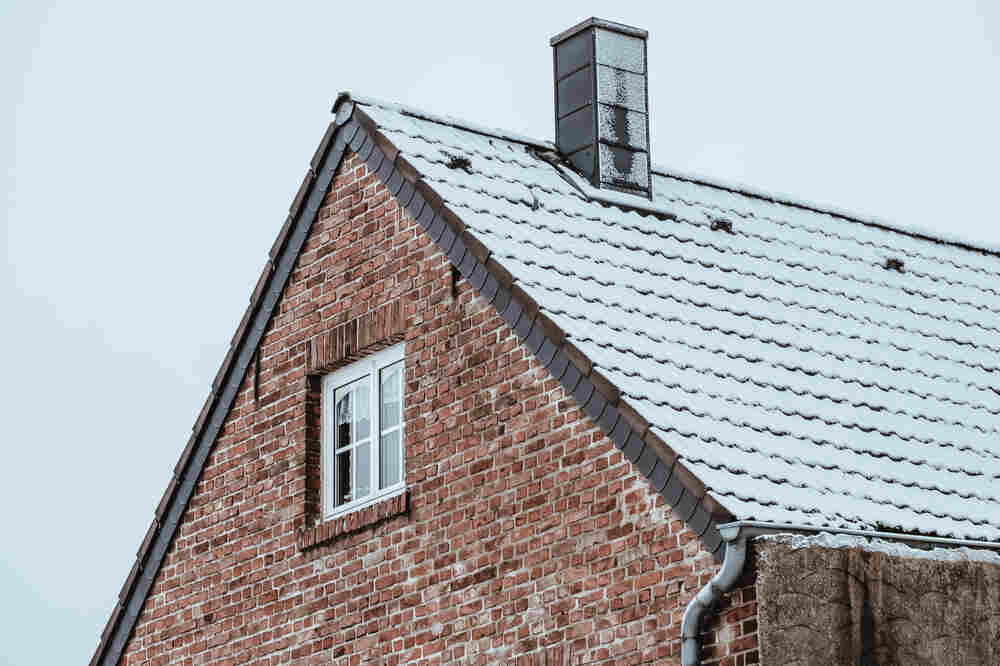 Roof chimney on winter