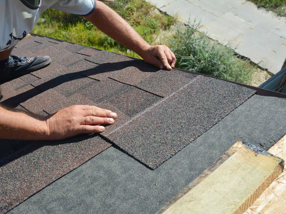 placing roof shingle