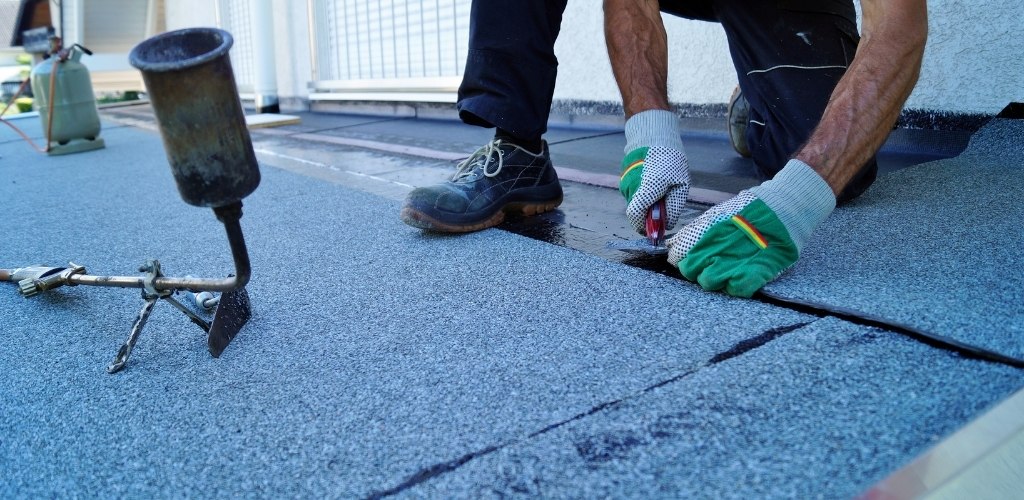 installing a torch-on bitumen waterproofing membrane